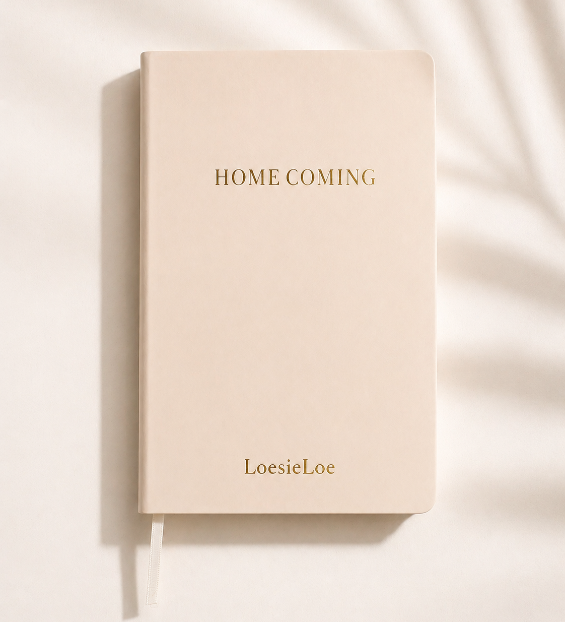 Homecoming notebook in A5 size with a soft cover, subtle golden details and ribbon bookmark.
